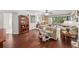Bright living room with hardwood floors and sliding glass doors to balcony at 1166 Carmel Cir # 120, Casselberry, FL 32707
