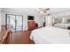 Bedroom with glass door access to the screened patio, closet space and neutral decor at 1166 Carmel Cir # 120, Casselberry, FL 32707