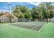 Well-maintained tennis court surrounded by lush greenery, providing residents with an opportunity for recreation and fitness at 1166 Carmel Cir # 120, Casselberry, FL 32707