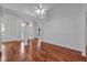 Large open living area featuring hardwood floors, bright light and arched doorways at 12713 Pine Arbor Dr, Clermont, FL 34711
