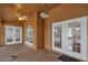 A cozy patio featuring tile floors, ceiling fans and multiple windows and doors at 12713 Pine Arbor Dr, Clermont, FL 34711