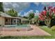 Spacious backyard with greenery, patio, and an above ground pool and room to enjoy at 14063 Ithaca Way, Orlando, FL 32826