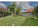 A well maintained, private backyard with a grass area and a fenced perimeter at 14063 Ithaca Way, Orlando, FL 32826