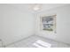 Bedroom featuring white walls, white tile flooring, ceiling fan and window at 14063 Ithaca Way, Orlando, FL 32826