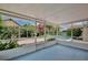 The screened-in patio offers lovely backyard views with a spa-like water feature at 14063 Ithaca Way, Orlando, FL 32826