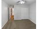 Bedroom featuring carpet floors, ceiling fan, and closet for ample storage space at 142 E 9Th St, Chuluota, FL 32766