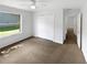 Bedroom with carpet floors, a window for natural light, and closet for ample storage space at 142 E 9Th St, Chuluota, FL 32766