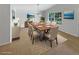 Formal dining room features an elegant table setting, pendant lighting, and a large window at 142 E 9Th St, Chuluota, FL 32766