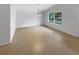 Vacant formal dining room featuring a chandelier and a bright window at 142 E 9Th St, Chuluota, FL 32766