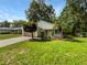 Inviting single-story home with a cozy front porch and mature landscaping at 142 E 9Th St, Chuluota, FL 32766