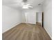 Main bedroom with carpet floors, ceiling fan, and ensuite bathroom and walk-in closet at 142 E 9Th St, Chuluota, FL 32766