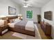 Inviting bedroom with a large window, ceiling fan, and a stylish decor at 142 E 9Th St, Chuluota, FL 32766