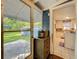 View of the backyard and kitchen through the open door at 1642 Mount Vernon St, Orlando, FL 32803