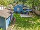 Backyard with a grassy area, garage, patio, and blue umbrella at 1642 Mount Vernon St, Orlando, FL 32803