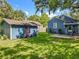 Backyard area with a garage, patio, and blue umbrella at 1642 Mount Vernon St, Orlando, FL 32803