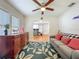 Charming living room featuring hardwood floors, a ceiling fan, and comfortable seating at 1642 Mount Vernon St, Orlando, FL 32803