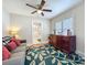 Comfortable living area featuring hardwood floors, plush sofa, and ample natural light at 1642 Mount Vernon St, Orlando, FL 32803