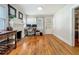 Inviting living area with hardwood floors, fireplace, and a dedicated workspace by the window at 1642 Mount Vernon St, Orlando, FL 32803