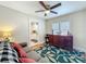 Living area view with hardwood floors, comfy sofa and a peek into the kitchen at 1642 Mount Vernon St, Orlando, FL 32803