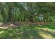 Tranquil backyard with mature trees providing shade, creating a park-like setting at 18166 Lynbrook Rd, Orlando, FL 32820