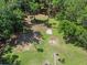 A generous lot ready to build on, surrounded by lush greenery and tall trees at 18166 Lynbrook Rd, Orlando, FL 32820