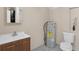 Bathroom with vanity, toilet, and hot water heater at 18166 Lynbrook Rd, Orlando, FL 32820