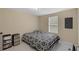 Cozy bedroom featuring a comfortable bed, ample natural light, and functional storage at 18166 Lynbrook Rd, Orlando, FL 32820