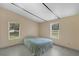 Bright bedroom with tile floors and two large windows overlooking a lush landscape at 18166 Lynbrook Rd, Orlando, FL 32820