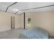 Bedroom featuring tile floors, two large windows, and a view of the ensuite bath at 18166 Lynbrook Rd, Orlando, FL 32820