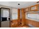Bedroom with damaged ceilings, paneled walls, and window at 18166 Lynbrook Rd, Orlando, FL 32820