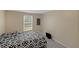 Serene bedroom featuring neutral walls, a comfortable bed, and a bright window at 18166 Lynbrook Rd, Orlando, FL 32820