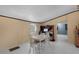 Open floor plan features a white table, four chairs and updated flooring at 18166 Lynbrook Rd, Orlando, FL 32820