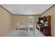 The dining area features a white table, four chairs, and updated flooring at 18166 Lynbrook Rd, Orlando, FL 32820