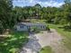Charming single-story home with neutral siding, complemented by a spacious, tree-lined yard at 18166 Lynbrook Rd, Orlando, FL 32820