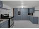 Well-equipped kitchen with blue cabinets, stainless steel appliances, and durable countertops at 18166 Lynbrook Rd, Orlando, FL 32820
