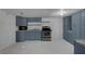Functional kitchen featuring ample cabinet space, modern appliances, and easy-to-clean floors at 18166 Lynbrook Rd, Orlando, FL 32820