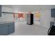 Open kitchen adjacent to laundry area, showcasing modern appliances and ample space at 18166 Lynbrook Rd, Orlando, FL 32820