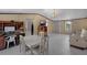 Open-concept living room featuring white flooring, neutral walls, and modern furnishings at 18166 Lynbrook Rd, Orlando, FL 32820