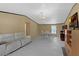 Open-concept living and dining area with white vinyl floors and modern furnishings and decor at 18166 Lynbrook Rd, Orlando, FL 32820