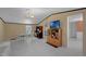 Bright and airy open concept living room featuring a dining area, entertainment center, and vinyl flooring at 18166 Lynbrook Rd, Orlando, FL 32820