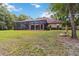 Expansive backyard with mature trees providing shade and privacy at 21795 Sw 88Th Lane Rd, Dunnellon, FL 34431