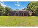 Large, grassy backyard is perfect for outdoor activities and entertaining at 21795 Sw 88Th Lane Rd, Dunnellon, FL 34431