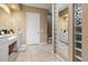 Bright bathroom featuring double vanity, neutral colors, and tile flooring at 21795 Sw 88Th Lane Rd, Dunnellon, FL 34431
