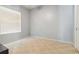 Neutral bedroom features carpet and a large window for natural light at 21795 Sw 88Th Lane Rd, Dunnellon, FL 34431