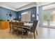 Bright dining room with tile floors and a beautiful blue accent wall at 21795 Sw 88Th Lane Rd, Dunnellon, FL 34431