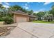 Spacious driveway with a two-car garage at 21795 Sw 88Th Lane Rd, Dunnellon, FL 34431