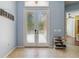 Welcoming entryway with tiled flooring, double doors, and ample space for storage and decor at 21795 Sw 88Th Lane Rd, Dunnellon, FL 34431