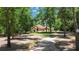Charming home with a long driveway and lush landscaping at 21795 Sw 88Th Lane Rd, Dunnellon, FL 34431