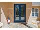 Inviting entrance with double doors, tiled porch, and decorative accents creating a welcoming curb appeal at 21795 Sw 88Th Lane Rd, Dunnellon, FL 34431