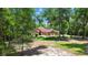 Beautiful home nestled among mature trees, has circular drive and well-maintained lawn at 21795 Sw 88Th Lane Rd, Dunnellon, FL 34431